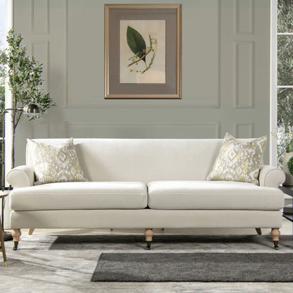 Alana Lawson Two Cushion Tightback Sofa cream upholstery with wooden bun feet on Tampa Home & Garden Store