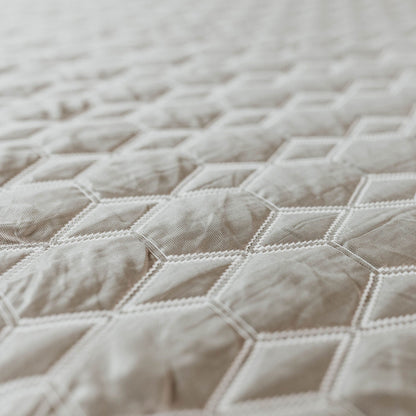 Copper Lux Hybrid 14in mattress fabric closeup shows beige striped quilted cover on Tampa Home & Garden Store