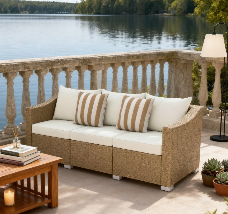 Outdoor rattan sofa set with cream cushions and beige striped pillows HouseOfZazla on Tampa Home & Garden Store