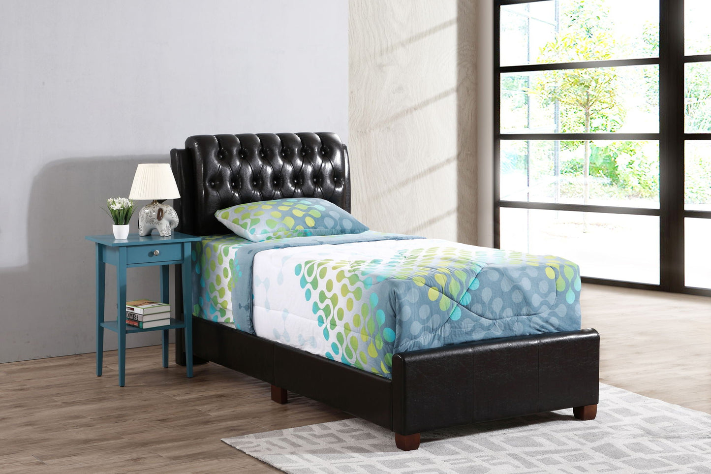 Tufted Upholstered Bed with black leather headboard blue nightstand and colorful bedding on Tampa Home & Garden Store
