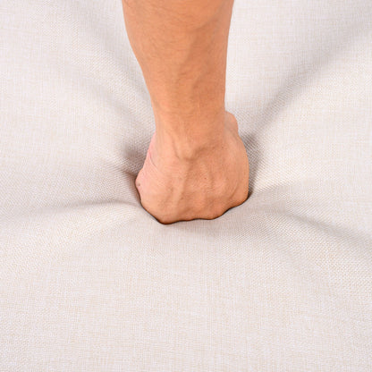 Close-up of a bare ankle and foot on a textured beige fabric background on Tampa Home & Garden Store