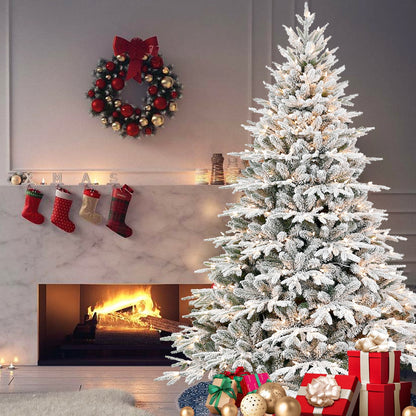 7.5 ft pre-lit flocked artificial Christmas tree with snow-dusted branches on Tampa Home & Garden Store