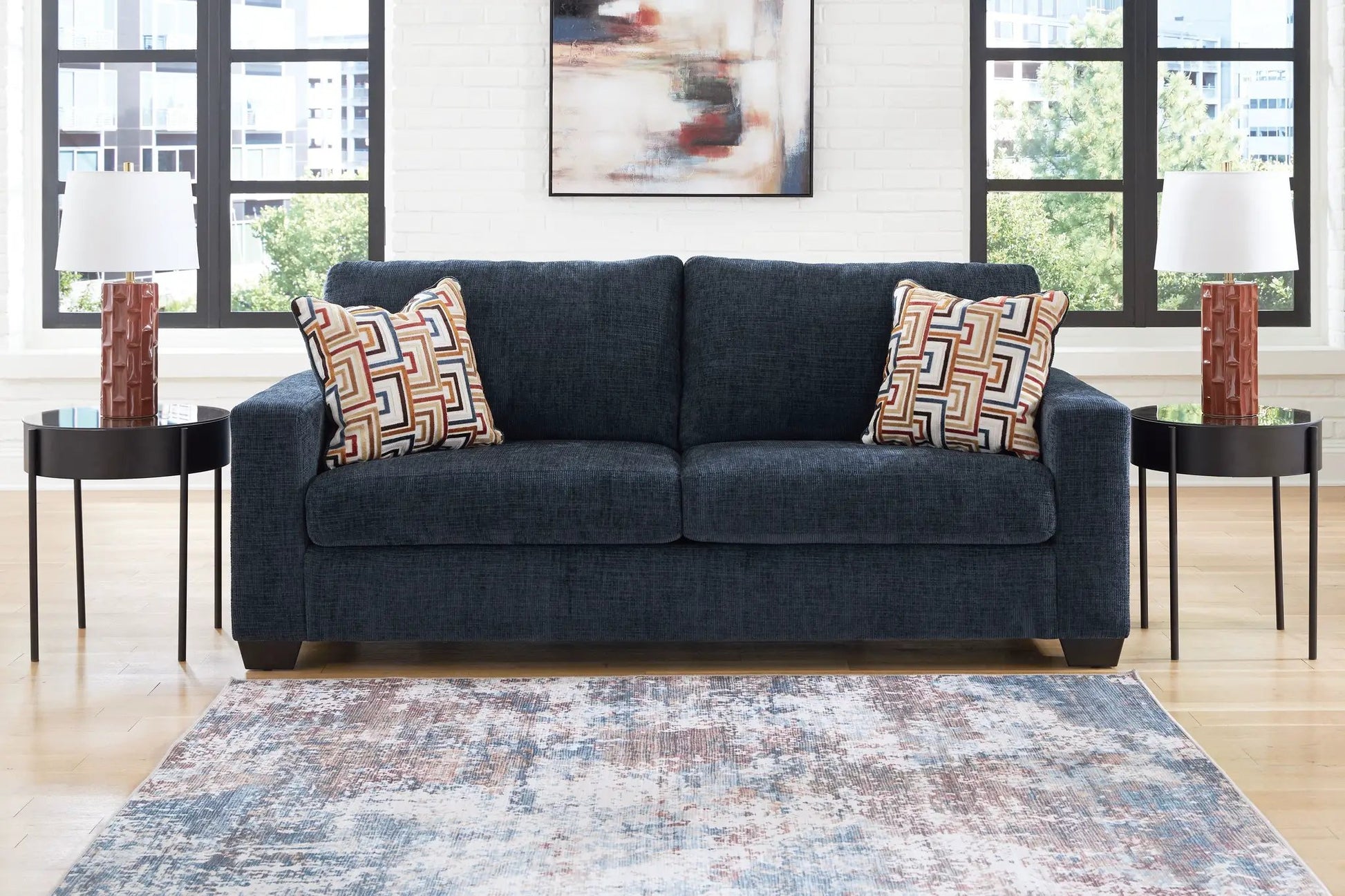 Aviemore stationary sofa by Unique Piece Furniture in dark blue upholstery with pillows on Tampa Home & Garden Store