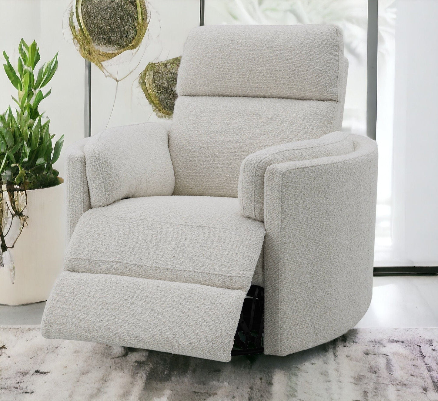 Sagen Glider Recliner With Swivel by HouseOfZazla in light beige boucle upholstery on Tampa Home & Garden Store