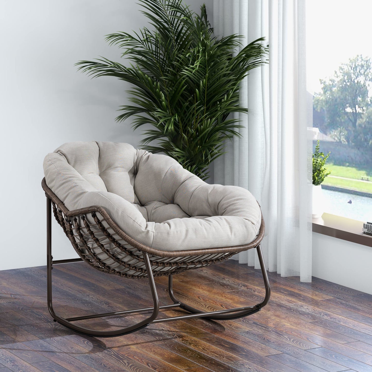 Outdoor Rattan Rocking Chair with Beige Cushion on dark brown wicker frame beside a plant on Tampa Home & Garden Store