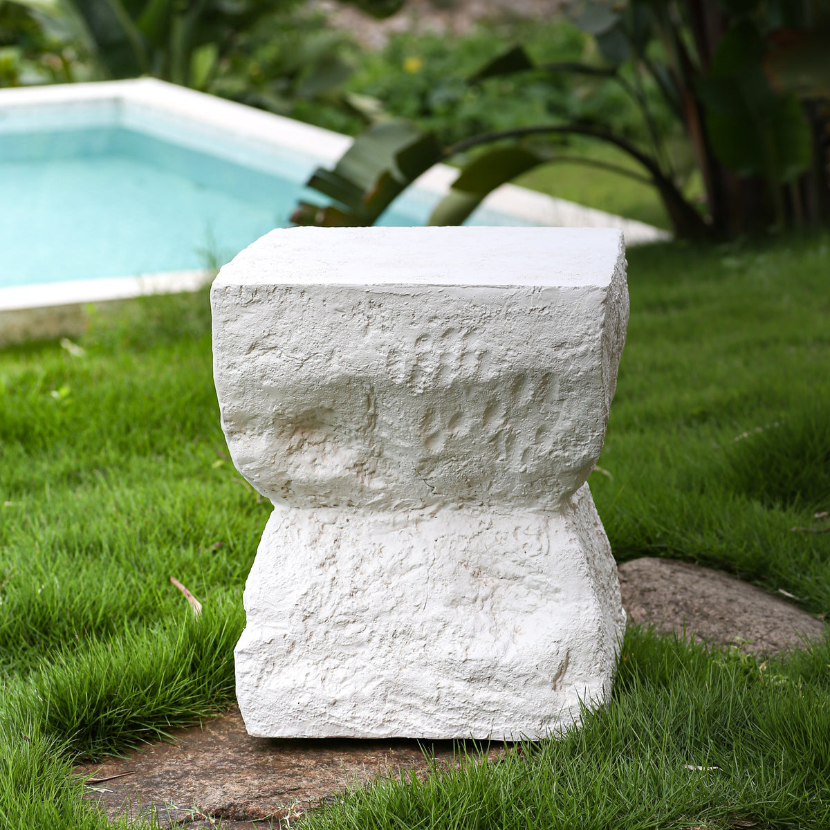 Cleo Outdoor Side Table HouseOfZazla white textured stone column near pool on Tampa Home & Garden Store
