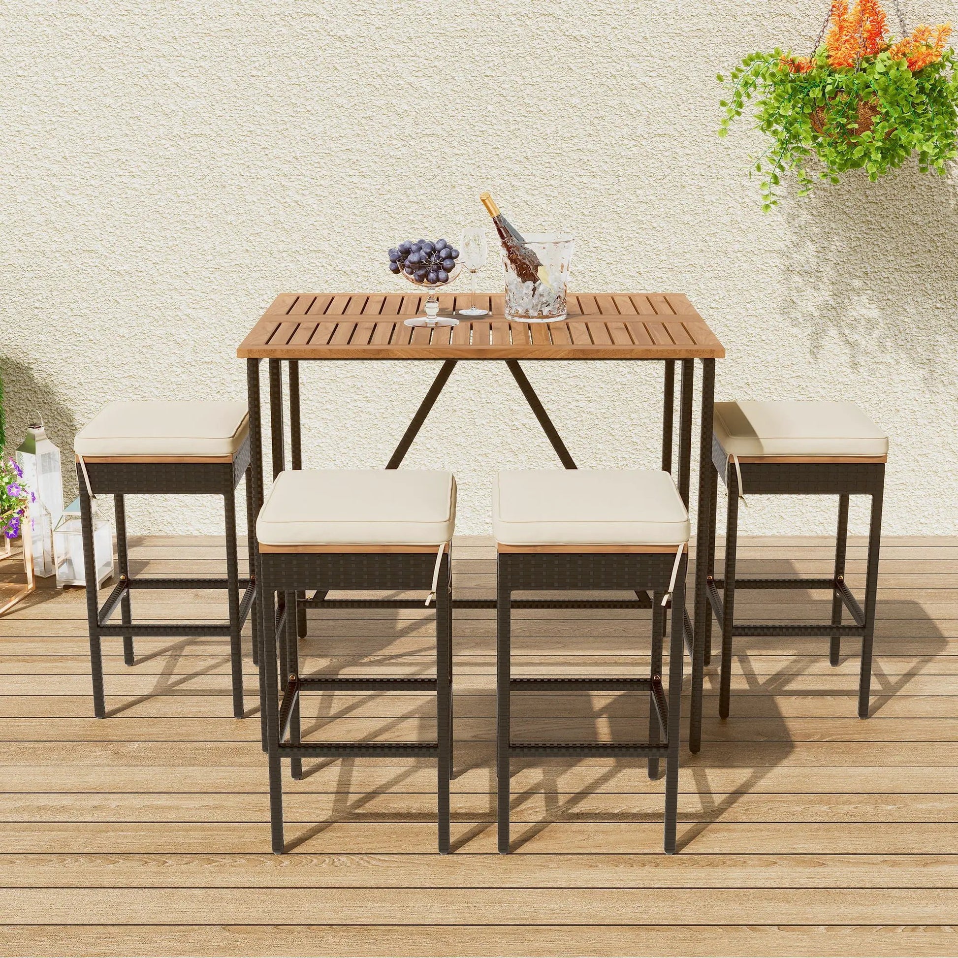 Outdoor acacia wood bar-height table with eight cushioned stools, wine bottle in ice bucket on Tampa Home & Garden Store