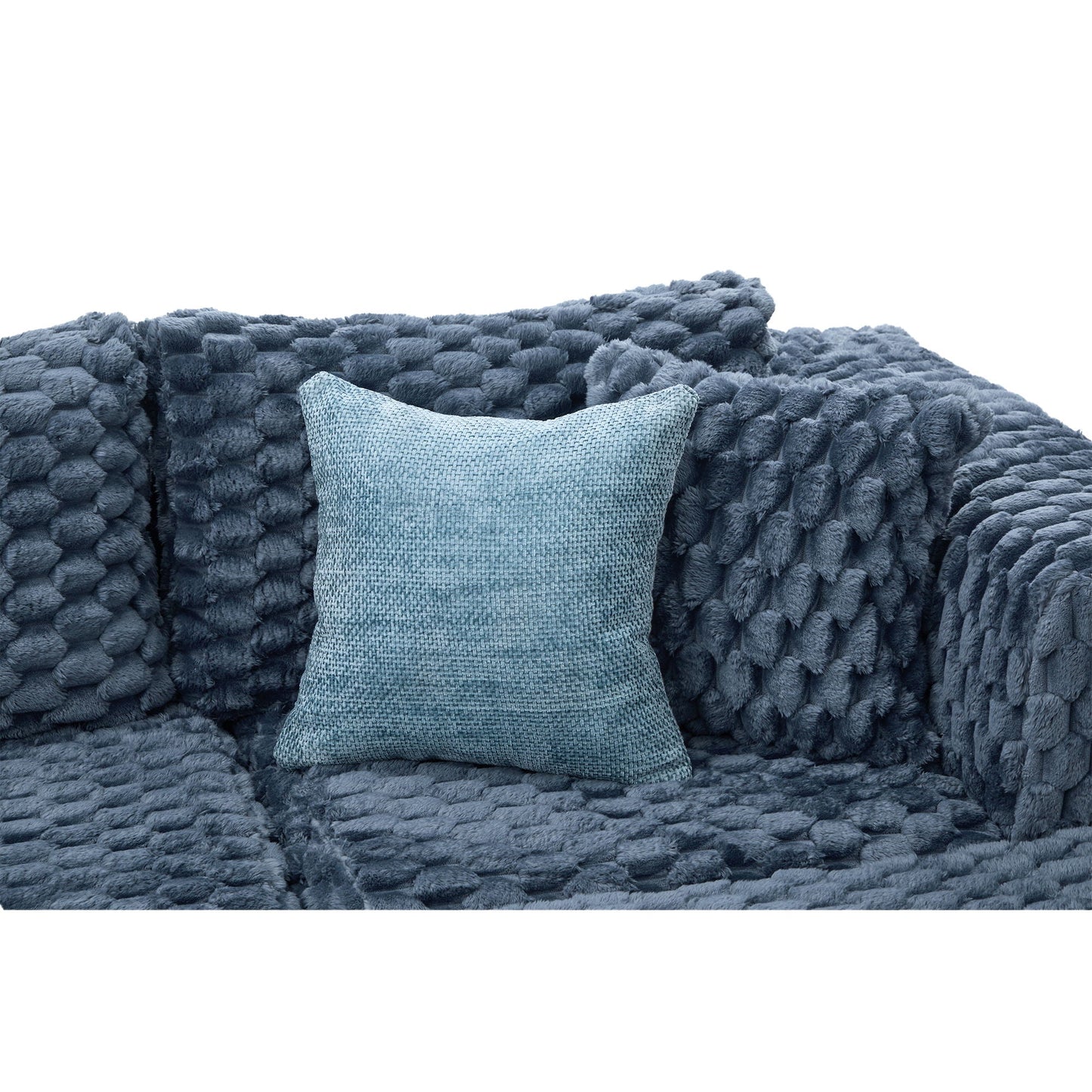 Modular sectional sofa with blue plush throw blanket and one textured cushion on Tampa Home & Garden Store