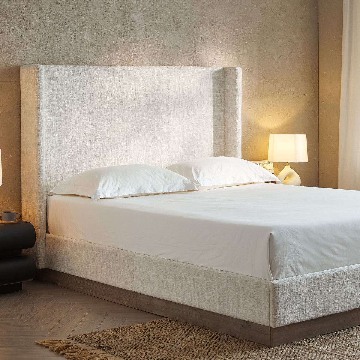 Hosford minimalist upholstered wingback bed with wood base platform in neutral beige fabric on Tampa Home & Garden Store