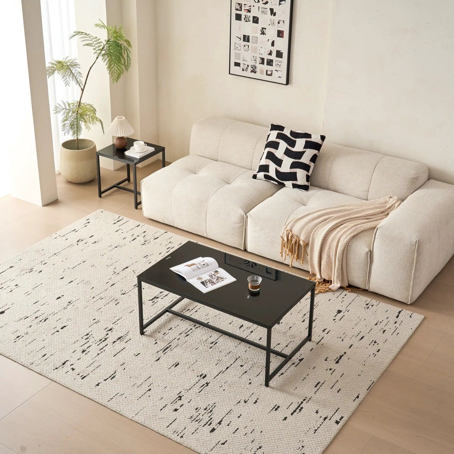 Coffee table by Unique Piece Furniture, black metal frame with glass top in living room on Tampa Home & Garden Store