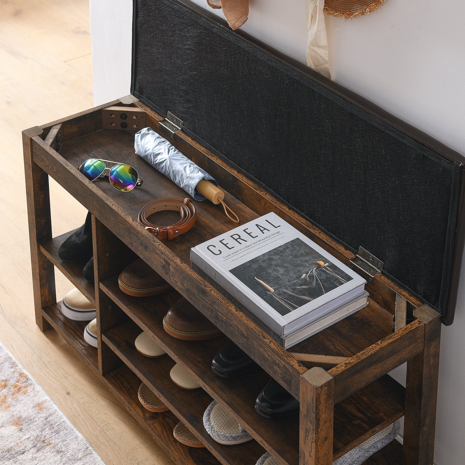 Height-Adjustable shoe-changing bench in dark wood with open storage shelves and shoes on Tampa Home & Garden Store
