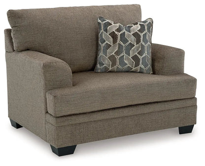 Stonemeade Living Room Set armchair in brown fabric with a blue geometric cushion on Tampa Home & Garden Store