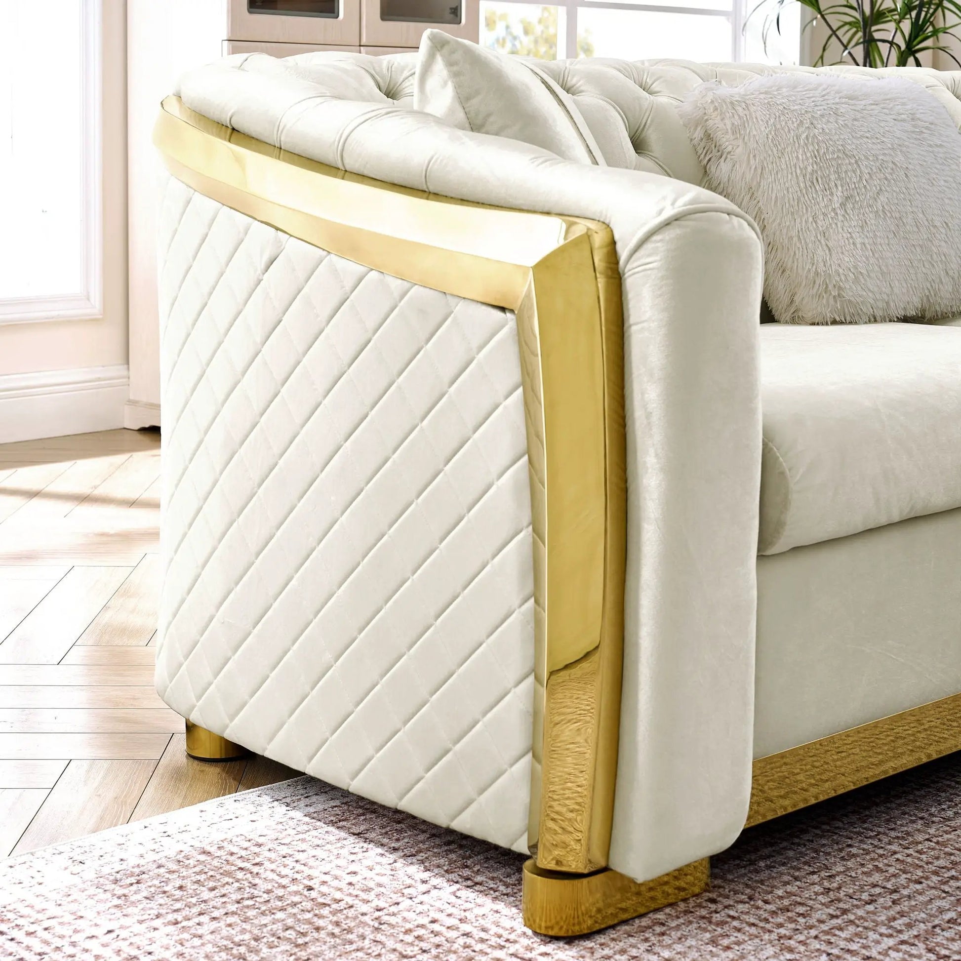 L-shaped stationary Chesterfield sectional with ivory velvet diamond-quilted, gold metal trim on Tampa Home & Garden Store