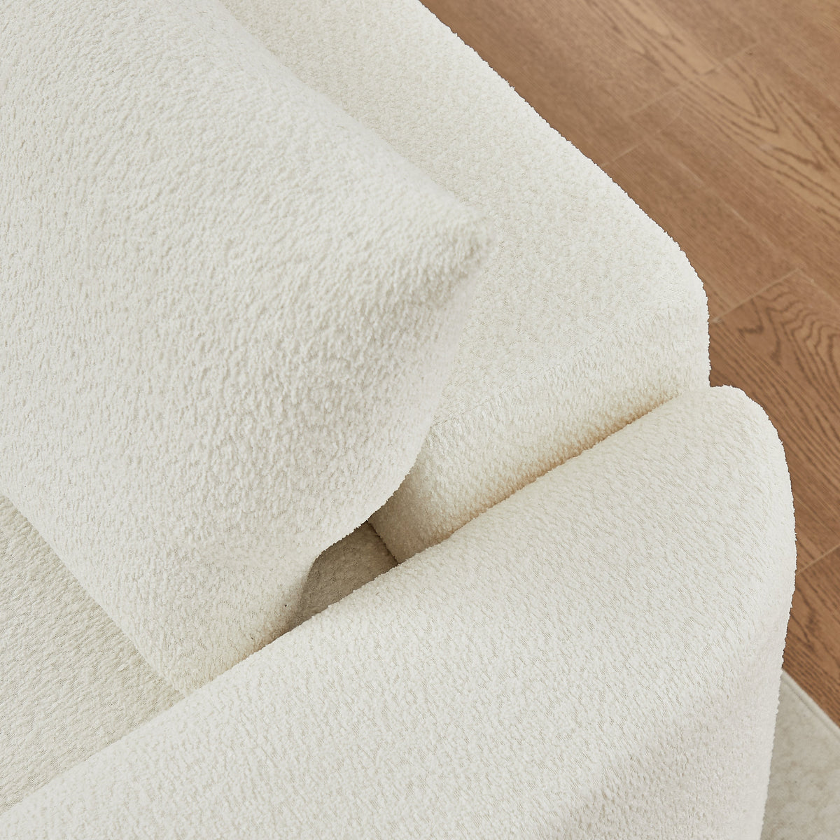 Chenille sofa ivory upholstery close-up with plush texture on wood floor by HouseOfZazla on Tampa Home & Garden Store