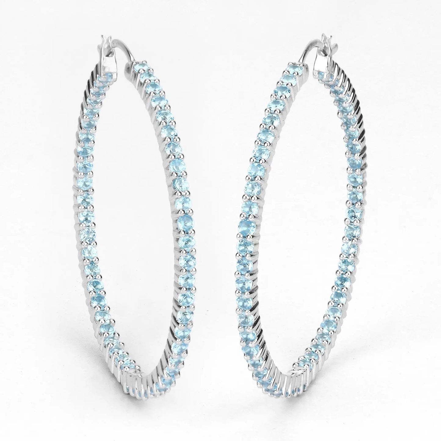 Pair of sterling silver hoop earrings set with 3.60ct Swiss blue topaz stones by Bids.com on Tampa Home & Garden Store