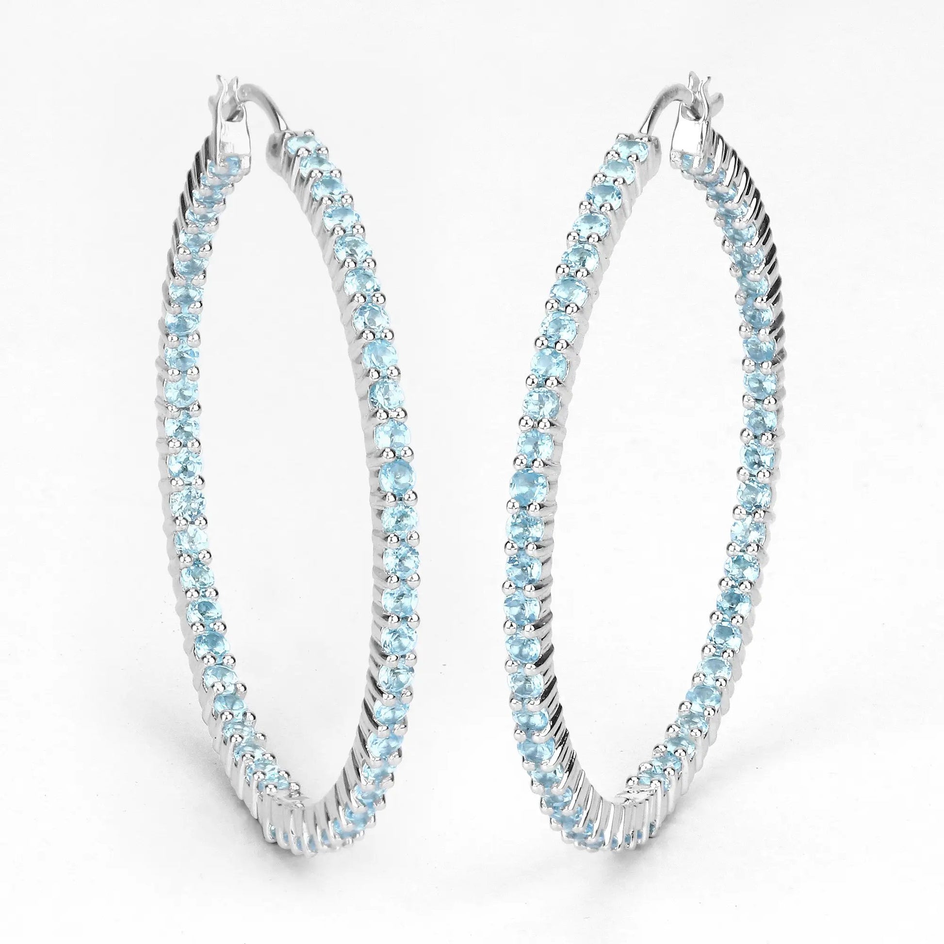 Pair of sterling silver hoop earrings set with 3.60ct Swiss blue topaz stones by Bids.com on Tampa Home & Garden Store