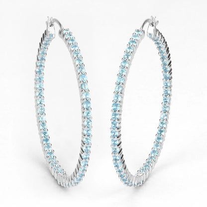 Pair of sterling silver hoop earrings set with 3.60ct Swiss blue topaz stones by Bids.com on Tampa Home & Garden Store
