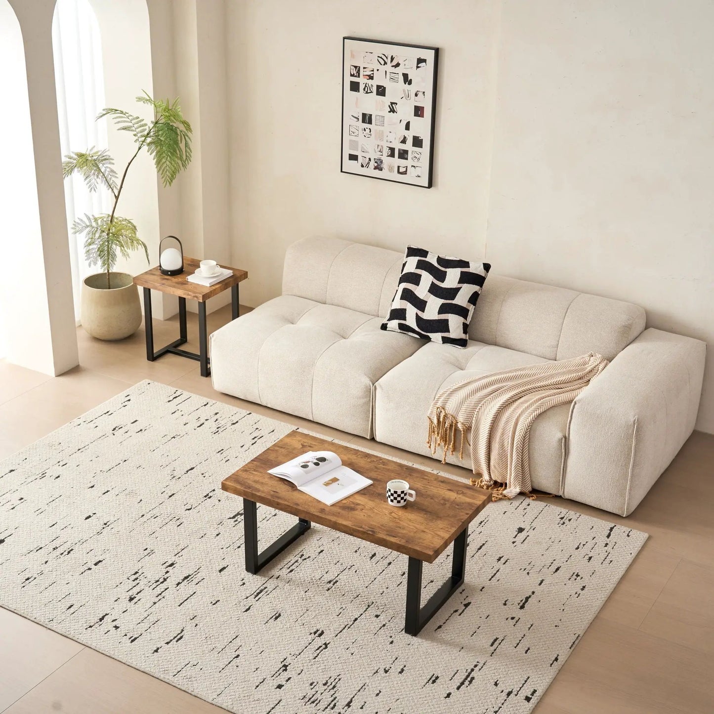 Coffee table with wood top and black metal legs in a living room on Tampa Home & Garden Store