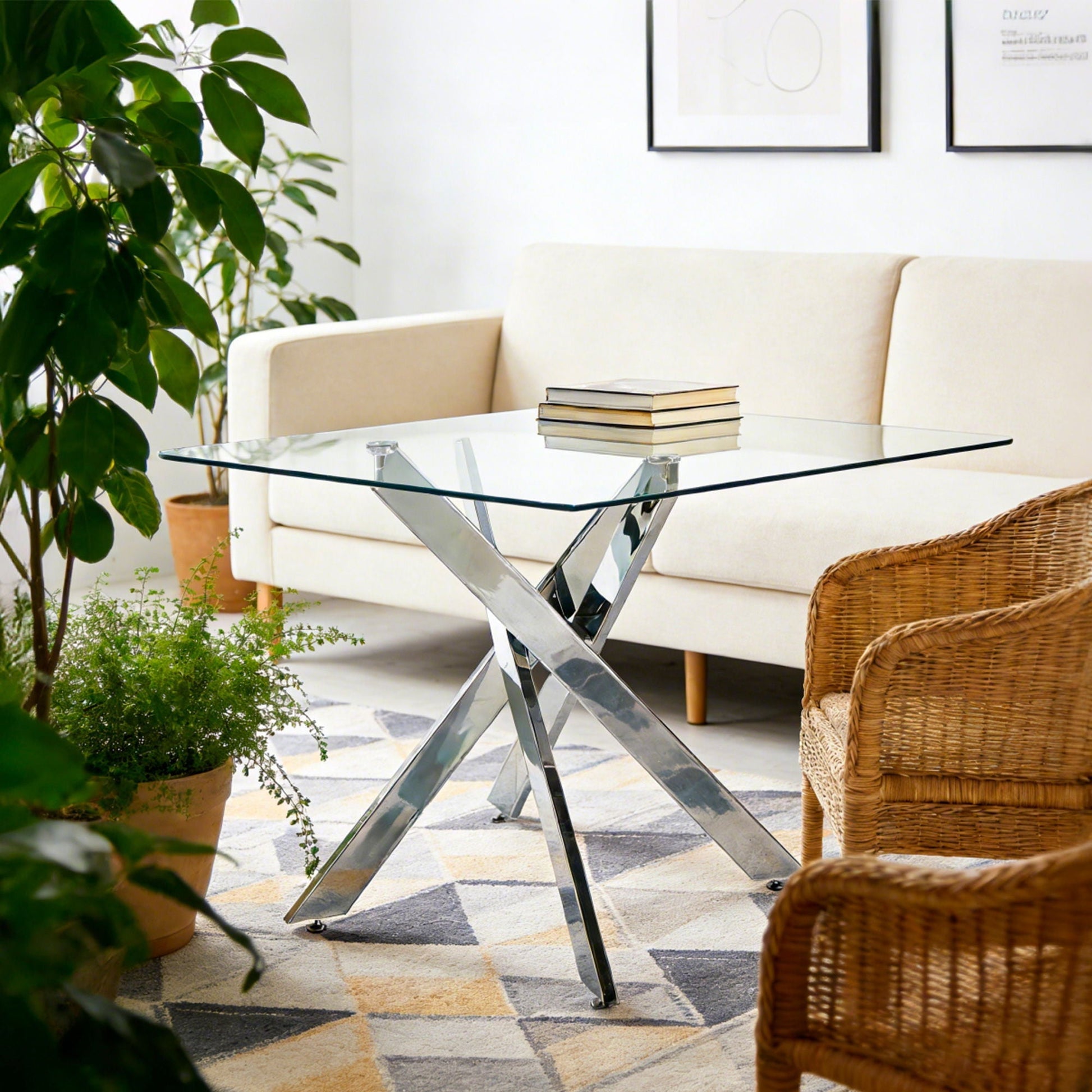 Dining table with tempered square glass top and cross chrome metal legs for a modern living room on Tampa Home & Garden Store