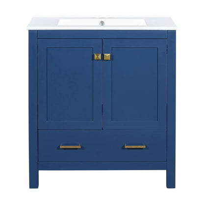 Bathroom vanity with single sink in blue, white countertop, doors with brass pulls on Tampa Home & Garden Store