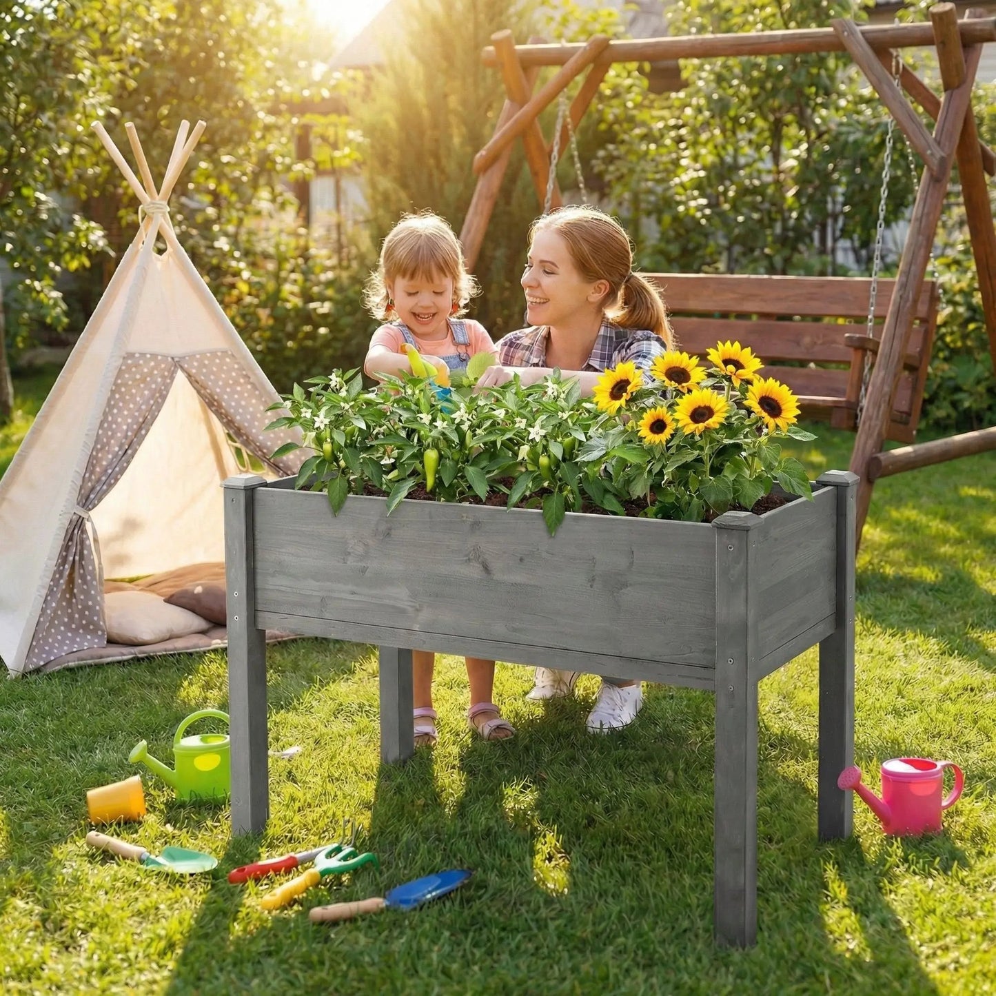 Elevated raised garden bed in gray wood filled with greenery and sunflowers on Tampa Home & Garden Store