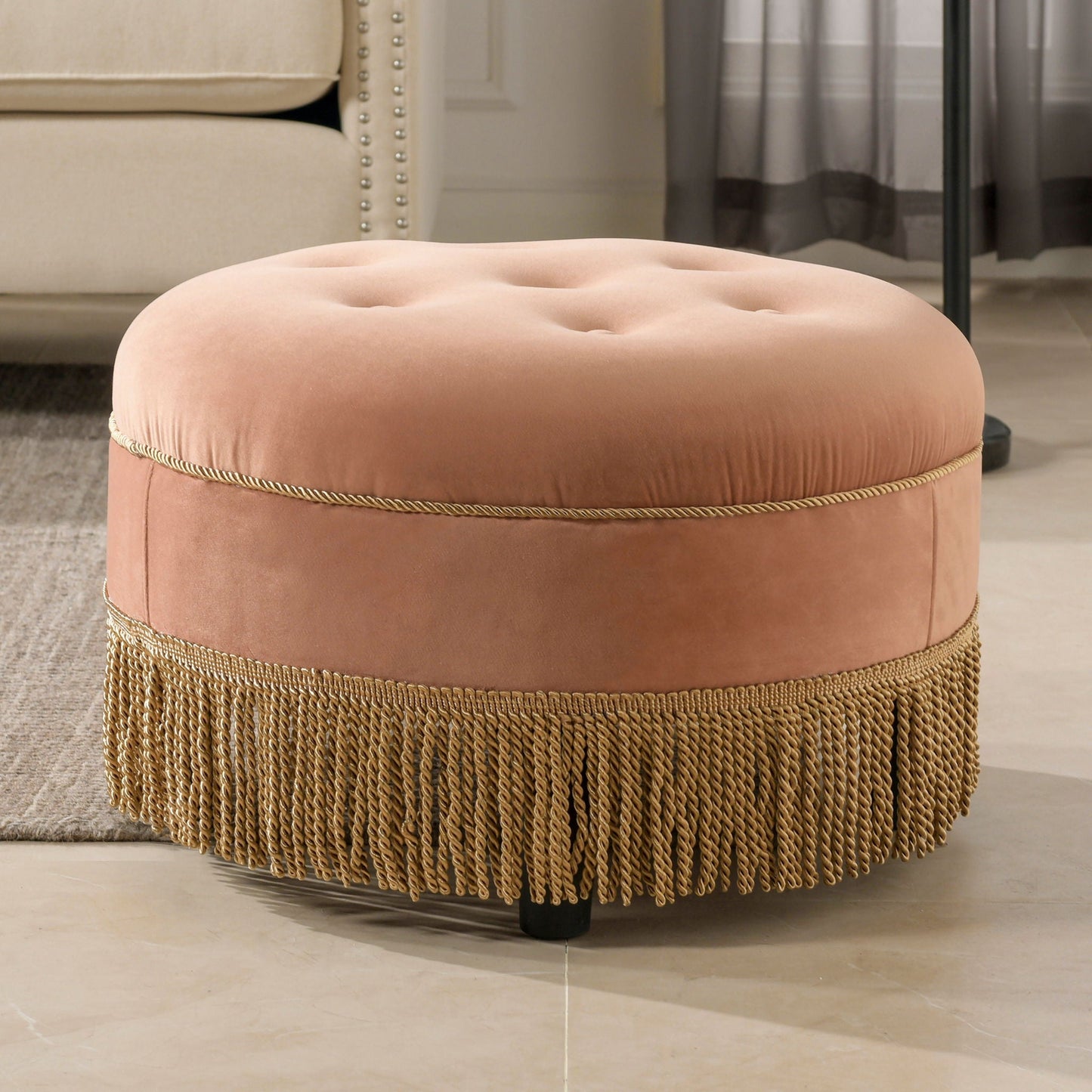 Yolanda round upholstered accent ottoman in blush velvet with tufted top and gold rope fringe on Tampa Home & Garden Store