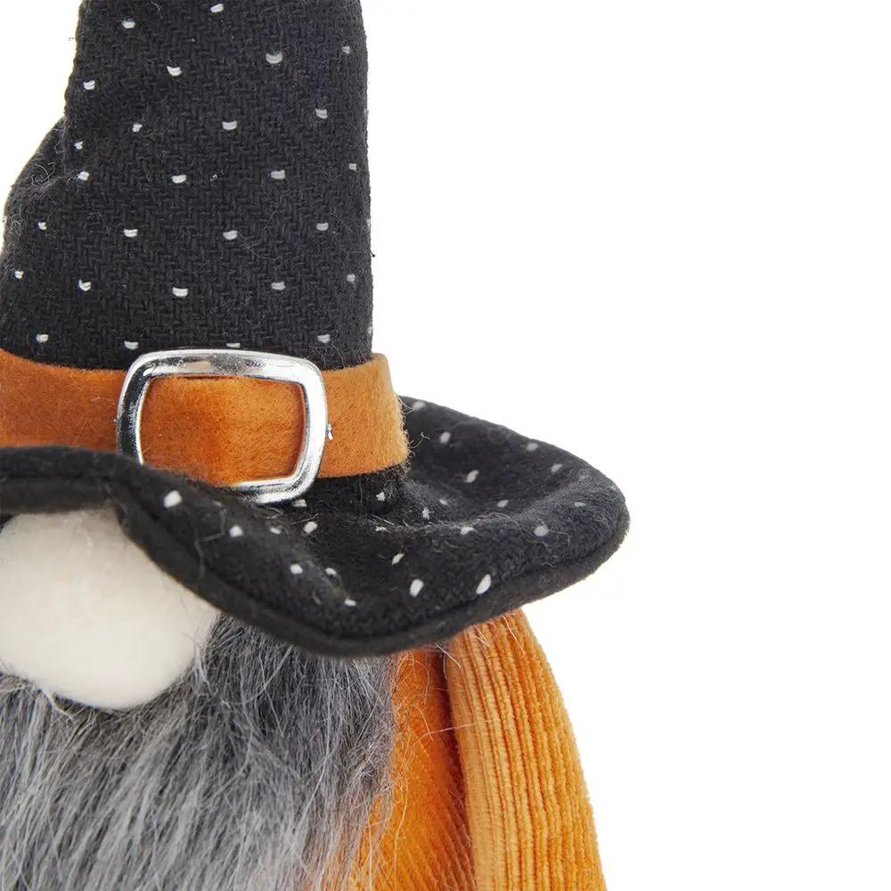 Gnome figurine closeup: tall black dotted hat with orange strap and silver buckle, gray beard on Tampa Home & Garden Store