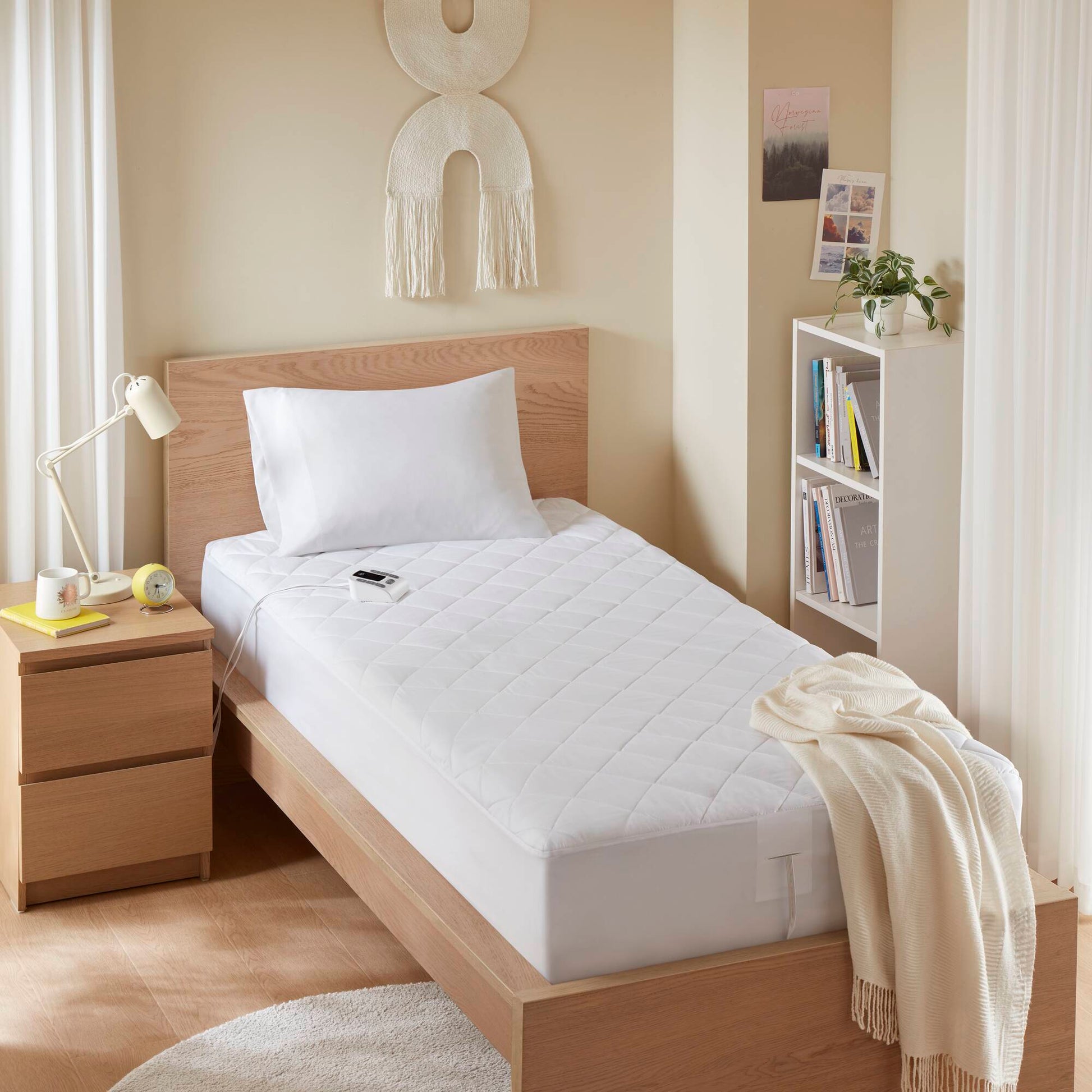 1-Piece Full Heated Mattress Pad by HouseOfZazla, white quilted surface on a wooden bed on Tampa Home & Garden Store
