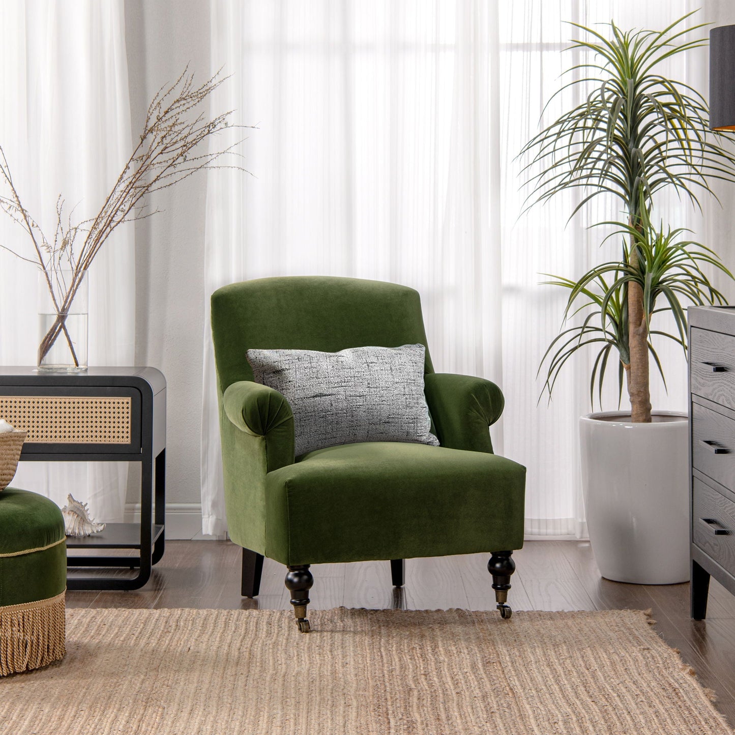 Eloise pleated sock-arm accent chair in emerald velvet with gray pillow and black legs on Tampa Home & Garden Store