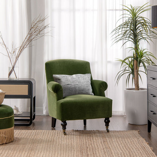 Eloise pleated sock-arm accent chair in emerald velvet with gray pillow and black legs on Tampa Home & Garden Store