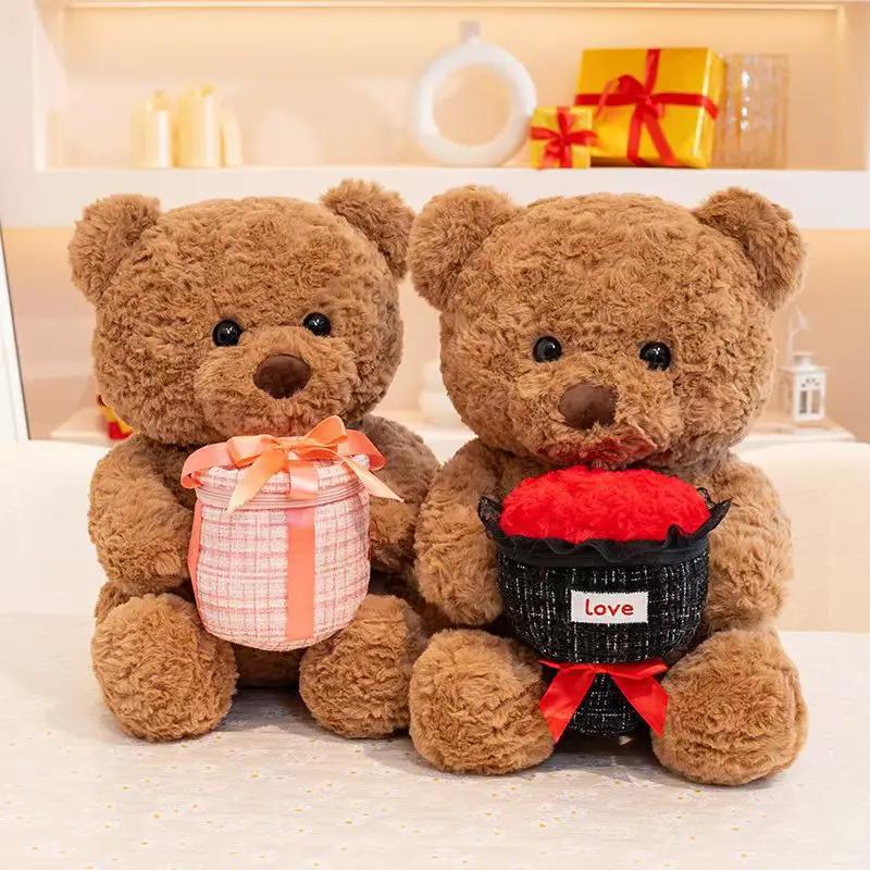 Teddy bears, two brown plush, hold a pink plaid present and red plush heart on Tampa Home & Garden Store