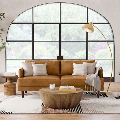 Livingston Upholstered Sofa with tan leather upholstery in a bright living room on Tampa Home & Garden Store