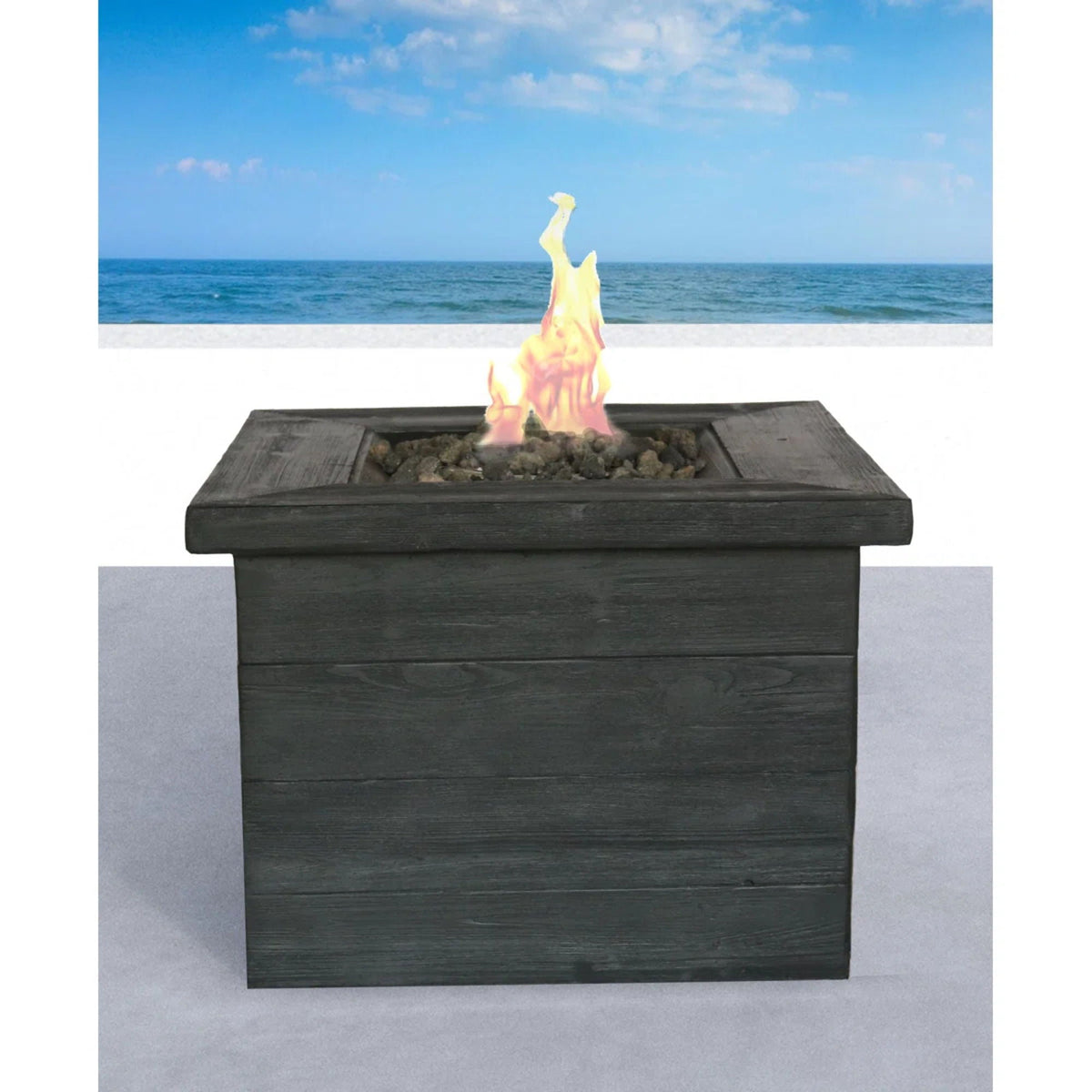 Fiber reinforced fire pit table with 40,000 BTU output in charcoal black lava rocks and flame on Tampa Home & Garden Store