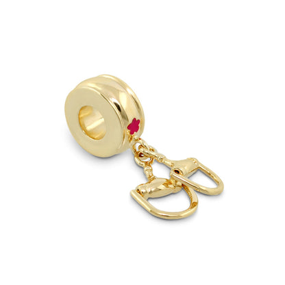 Gabriella Beads Stirrups charm by Lauren G Adams, gold-tone bead with hole and mini stirrups, pink flower accent on Tampa Home & Garden Store