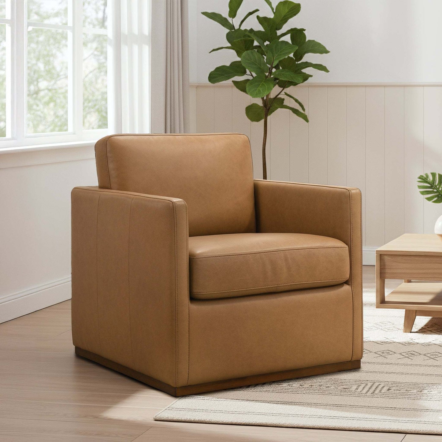 Darien tan leather swivel chair with boxy arms and padded seat in a bright living room on Tampa Home & Garden Store