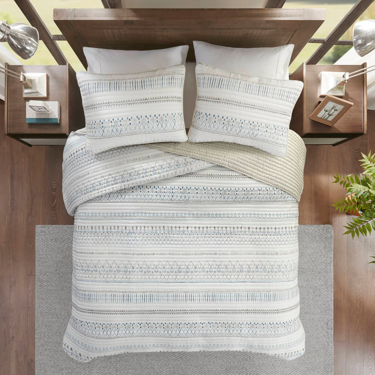 Printed Microfiber Seersucker Quilt Set taupe/blue reversible design on bed with 2 pillows on Tampa Home & Garden Store