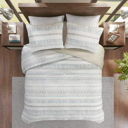 Printed Microfiber Seersucker Quilt Set taupe/blue reversible design on bed with 2 pillows on Tampa Home & Garden Store
