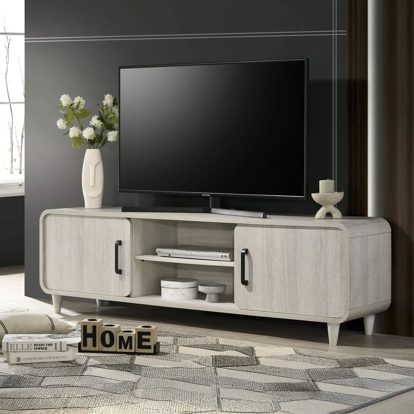 Unique Piece Furniture TV stand with sliding doors in antique white wood with black hardware on Tampa Home & Garden Store
