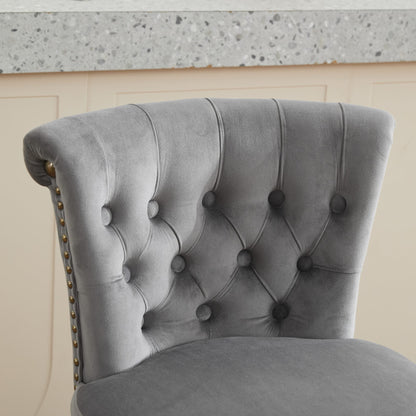 Gray velvet tufted chair with buttoned back and brass nailhead trim on Tampa Home & Garden Store