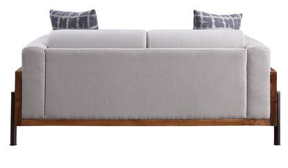 Pelton loveseat with 2 patterned blue-gray pillows and walnut base HouseOfZazla on Tampa Home & Garden Store
