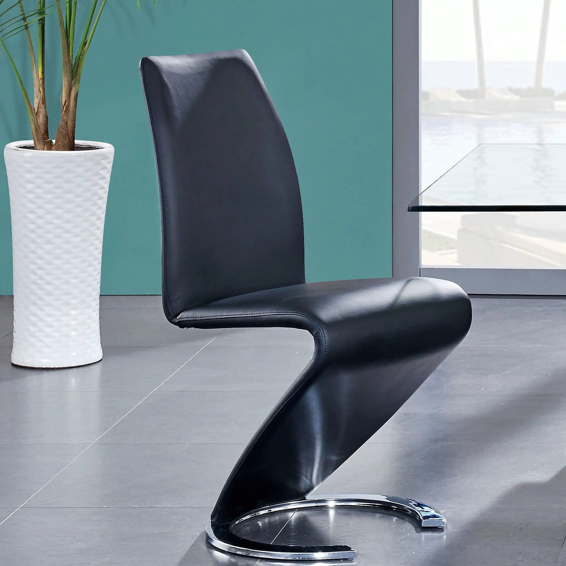 Marcus Horseshoe Dining Chair in black leather with cantilever chrome base on Tampa Home & Garden Store