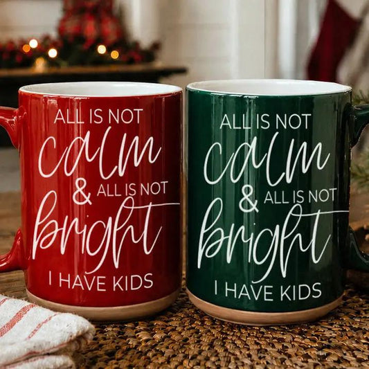 Calm & Bright coffee mugs by Gia Roma, pair of red and green ceramic mugs with white script text on Tampa Home & Garden Store