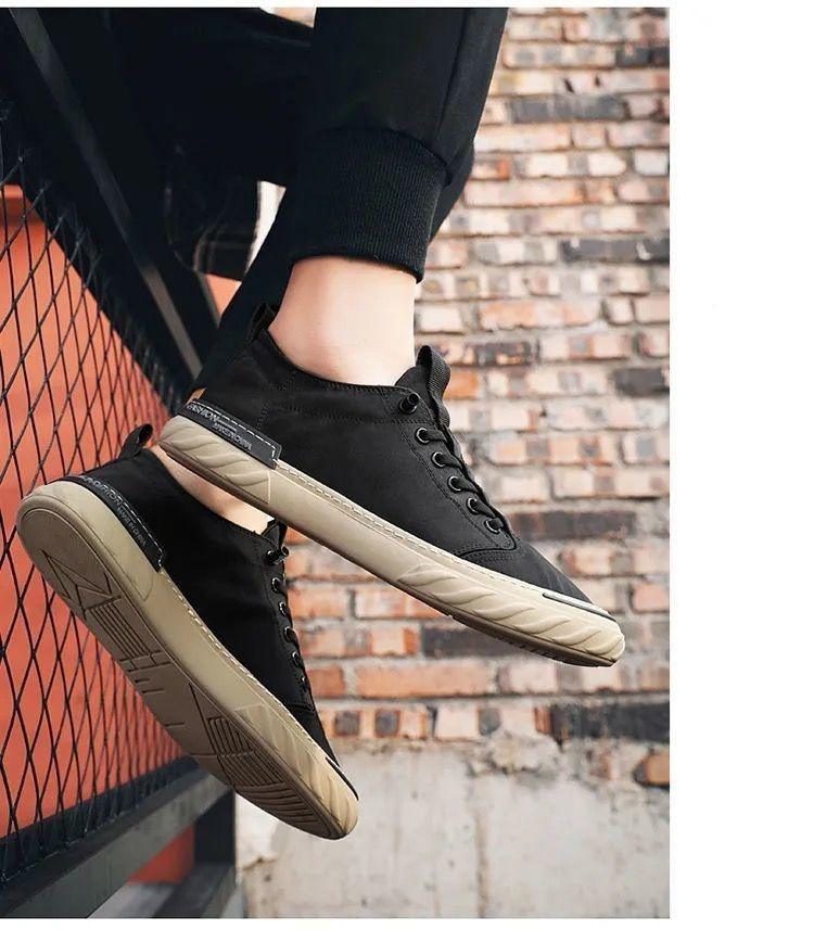 Pair of Stevvex canvas men's sneakers with black upper and beige sole on Tampa Home & Garden Store