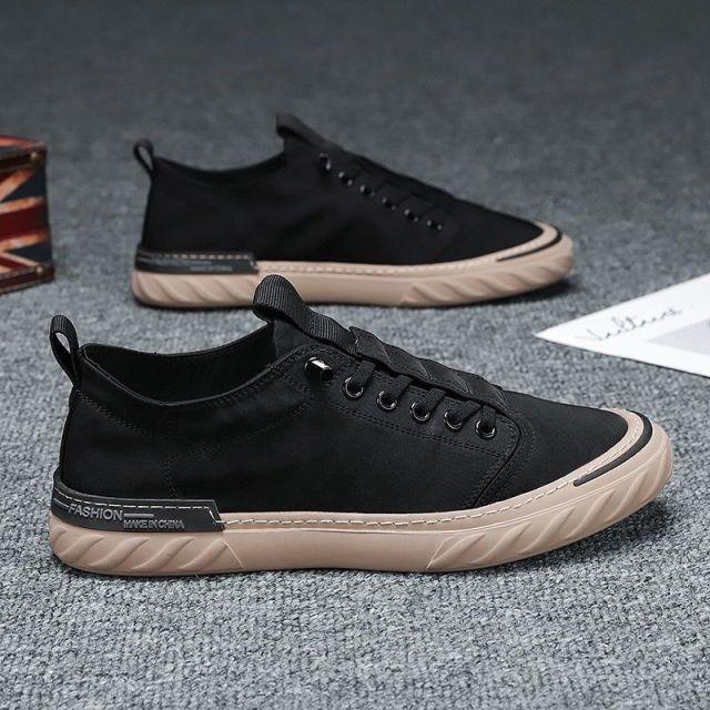 Pair of Stevvex canvas sneakers with black cloth upper and beige sole on Tampa Home & Garden Store
