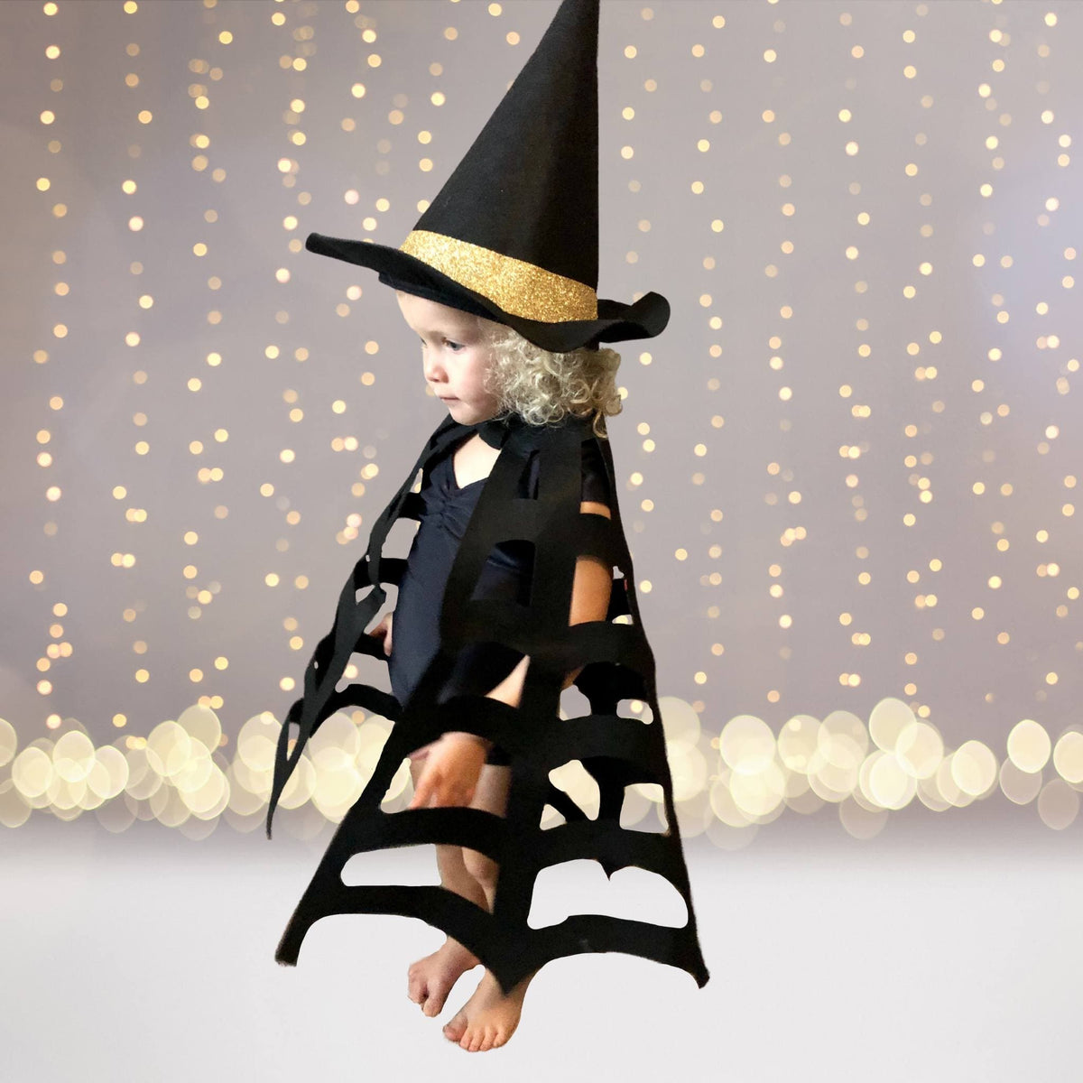 Kids Spider Web Cape, black cape with irregular shredded hem for Halloween cosplay worn by child on Tampa Home & Garden Store