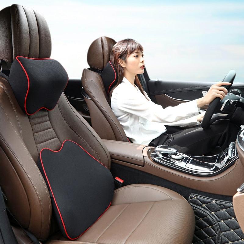 Car neck headrest pillow, black with red trim on brown leather seats; lumbar cushion on Tampa Home & Garden Store