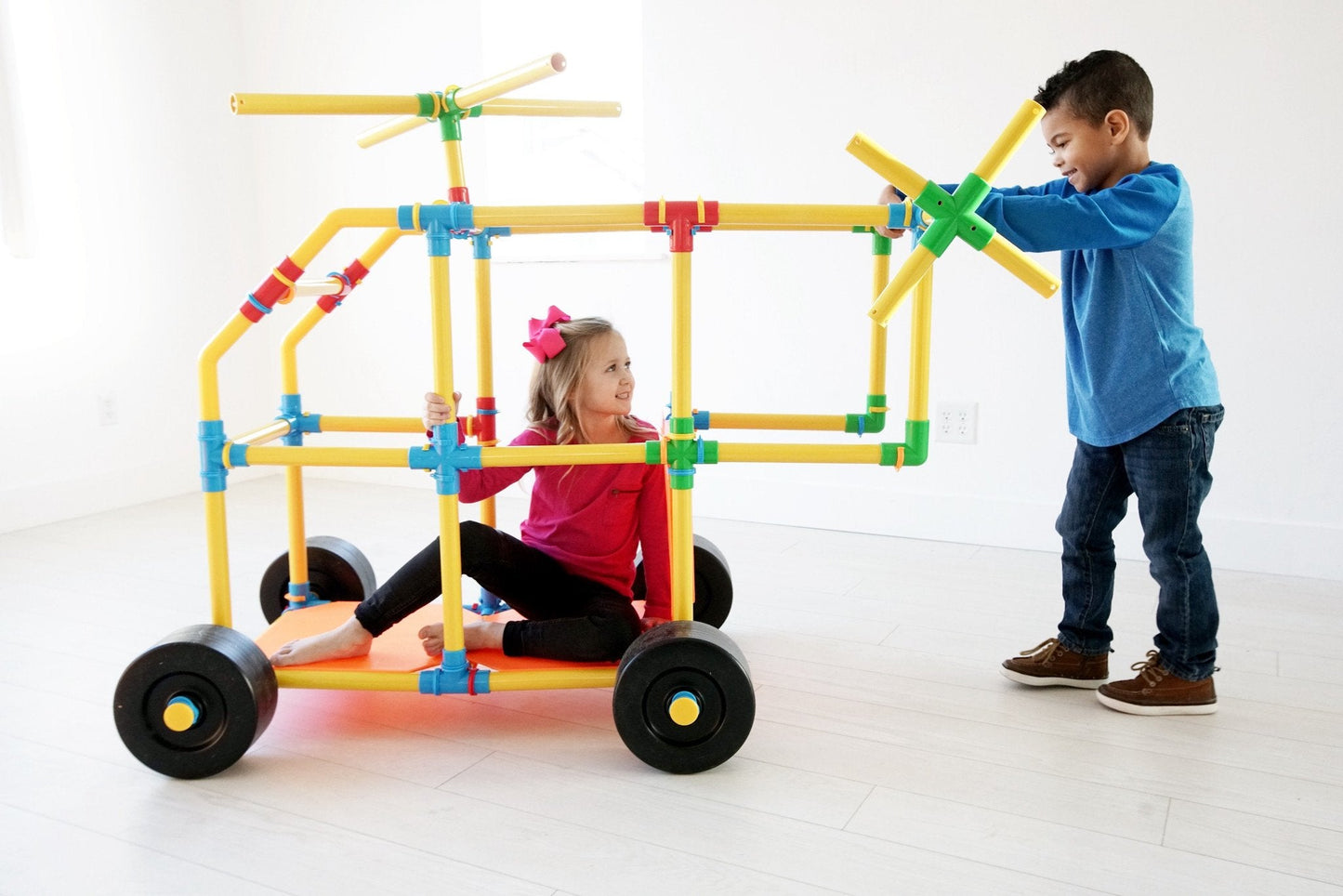 TubeLox Deluxe Set STEM toy yellow tube frame with blue and green connectors on wheels on Tampa Home & Garden Store