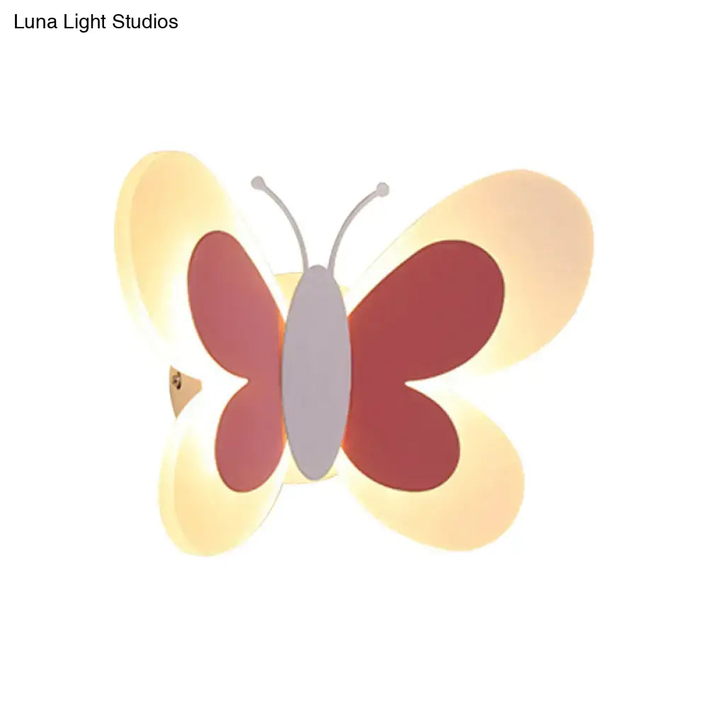 Butterfly LED Wall Light by Decorbites with pink wings and warm yellow glow on Tampa Home & Garden Store