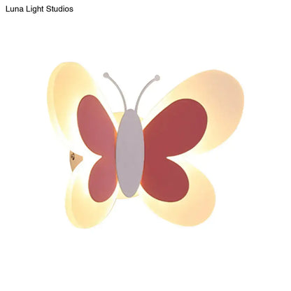 Butterfly LED Wall Light by Decorbites with pink wings and warm yellow glow on Tampa Home & Garden Store