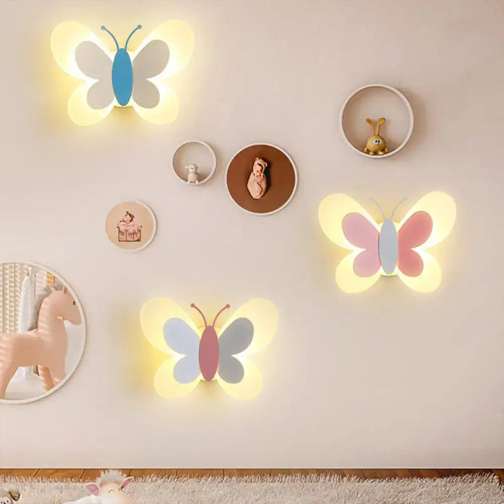 Butterfly LED wall light set with three pastel butterfly silhouettes and warm glow on wall on Tampa Home & Garden Store